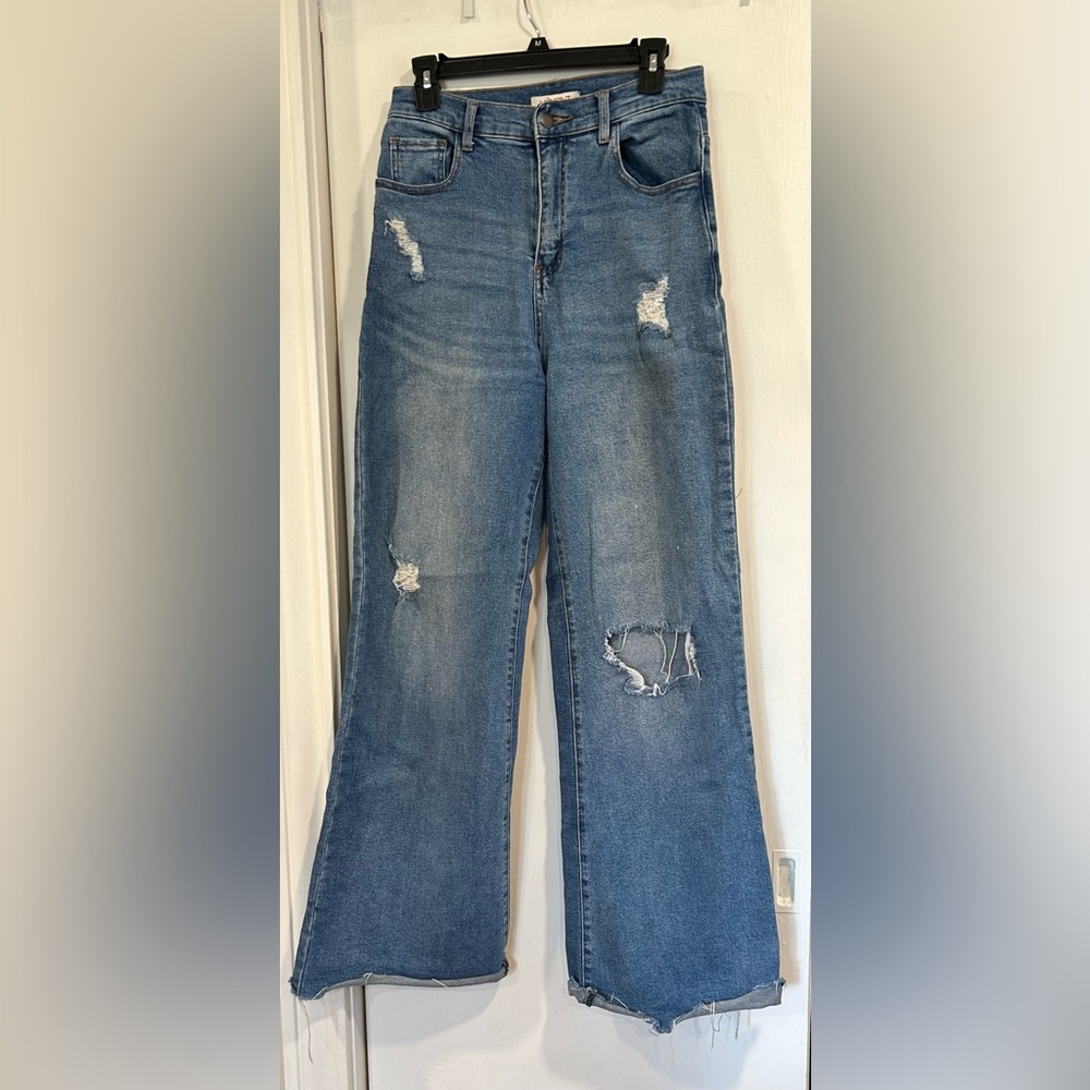 Vibrant high rise distressed raw hem jeans
